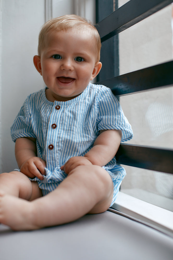 241-200-502 SEERSUCKER ROMPER W. SLEEVES -  SKY BLUE W CREAM STRIPE